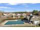 Aerial view of neighborhood pool with a covered area and surrounding homes at 7364 Laurel Valley Rd, Charlotte, NC 28273