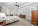 Spacious bedroom with trey ceilings, large windows, and stylish furniture at 7913 Buena Vista Dr, Denver, NC 28037