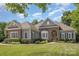 Charming single-story home featuring stone accents, manicured landscaping, and a warm, inviting entrance at 7913 Buena Vista Dr, Denver, NC 28037
