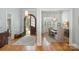 Elegant foyer showcasing hardwood floors, an arched doorway, and views into the dining area at 7913 Buena Vista Dr, Denver, NC 28037