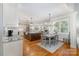 Open concept with an island kitchen, dining area, and view of the living room at 7913 Buena Vista Dr, Denver, NC 28037