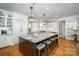Spacious kitchen island with granite countertops and bar stool seating at 7913 Buena Vista Dr, Denver, NC 28037