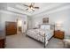Bright main bedroom showcasing trey ceilings and an ensuite bathroom at 7913 Buena Vista Dr, Denver, NC 28037
