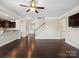 Open concept living room with wood floors and bright, neutral paint at 79357 Ridgehaven Rd, Lancaster, SC 29720