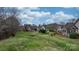 Manicured backyard with lush green grass and landscaping, ideal for outdoor enjoyment at 824 Wynnshire Dr # D, Hickory, NC 28601