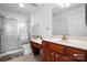Clean bathroom featuring a shower, toilet, wood cabinets, and white marble countertops at 824 Wynnshire Dr # D, Hickory, NC 28601