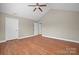 Bright bedroom with hardwood floors, a ceiling fan, and a neutral color palette at 824 Wynnshire Dr # D, Hickory, NC 28601
