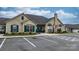 Exterior shot of stone-clad community clubhouse with well-maintained landscaping and ample parking at 824 Wynnshire Dr # D, Hickory, NC 28601