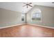Hardwood floors and a neutral paint color provide a blank canvas in this room with large windows at 824 Wynnshire Dr # D, Hickory, NC 28601