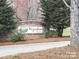 Community signage with lush greenery and a well-maintained stone wall at 824 Wynnshire Dr # D, Hickory, NC 28601