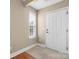 Inviting entryway with tile floors, window, and a white front door at 824 Wynnshire Dr # D, Hickory, NC 28601