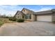 Charming stone house with a two-car garage and mature landscaping at 824 Wynnshire Dr # D, Hickory, NC 28601