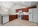 Well-lit kitchen featuring wooden cabinets, modern appliances, and tile backsplash at 824 Wynnshire Dr # D, Hickory, NC 28601