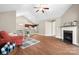 Spacious living area with fireplace, vaulted ceiling, hardwood floors, and open layout to kitchen at 824 Wynnshire Dr # D, Hickory, NC 28601