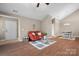 Open-concept living room with vaulted ceilings, seamless flow to dining area, and lots of natural light at 824 Wynnshire Dr # D, Hickory, NC 28601