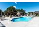 Community pool area featuring lounge chairs, tables, umbrellas and a pergola at 824 Wynnshire Dr # D, Hickory, NC 28601