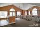 Bright recreation room with billiards table, dining tables and serving bar at 824 Wynnshire Dr # D, Hickory, NC 28601