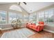 Bright sunroom with vaulted ceilings, ample windows, and a comfortable couch for relaxation at 824 Wynnshire Dr # D, Hickory, NC 28601
