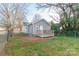 A view of the home's backyard featuring a small deck and chain link fence at 904 Indiana St, Kannapolis, NC 28083