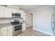 Kitchen featuring stainless steel appliances, granite countertops, and ample cabinet space at 904 Indiana St, Kannapolis, NC 28083