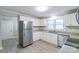 Bright kitchen features white cabinets, granite countertops, and stainless steel appliances at 904 Indiana St, Kannapolis, NC 28083