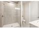 Bathroom with stand up shower featuring tiled walls and glass door, toilet, and sink with white countertops at 9534 Liberty Hill Dr # 196, Mint Hill, NC 28227