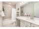 Bright bathroom with tub shower and vanity with white cabinets and sink at 9534 Liberty Hill Dr # 196, Mint Hill, NC 28227