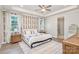 Serene main bedroom featuring a tray ceiling, modern wallpaper, and windows, creating a relaxing retreat at 9534 Liberty Hill Dr # 196, Mint Hill, NC 28227