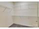 Spacious walk-in closet with carpeted floor and wire shelving at 1000 E Woodlawn Rd # 110, Charlotte, NC 28209