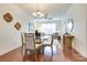 Open living concept of a well-lit dining area with hardwood floors and modern decor at 1000 E Woodlawn Rd # 110, Charlotte, NC 28209