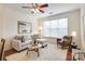 Comfortable living space with neutral paint, modern sofa, plush accent chair, and large window at 1000 E Woodlawn Rd # 110, Charlotte, NC 28209