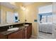 Bathroom featuring double sink vanity with granite counters and a view into a well-lit bedroom at 1008 Newton Ave, Rock Hill, SC 29732