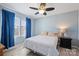 Cozy bedroom featuring a ceiling fan, wood floors and soft natural light from the window at 1008 Newton Ave, Rock Hill, SC 29732