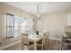 Dining area with decorative hanging light and window with curtains at 1008 Newton Ave, Rock Hill, SC 29732