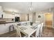 Open concept dining area with modern table and views into the kitchen space at 1008 Newton Ave, Rock Hill, SC 29732