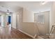 Hallway featuring hardwood floors, painted walls, natural lighting from the stairs, and well-placed doorways at 1008 Newton Ave, Rock Hill, SC 29732