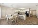 Bright eat-in kitchen with granite countertops, black appliances and modern lighting at 1008 Newton Ave, Rock Hill, SC 29732