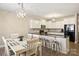 Bright eat-in kitchen with granite countertops, black appliances and modern lighting at 1008 Newton Ave, Rock Hill, SC 29732