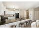 Modern kitchen with white cabinets, black countertops, and stainless steel appliances at 1008 Newton Ave, Rock Hill, SC 29732