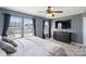 Main bedroom featuring large windows, TV, and plush bedding, offering natural light and a cozy ambiance at 1008 Newton Ave, Rock Hill, SC 29732