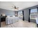 Main bedroom showcasing large windows and plush bedding, providing natural light and a relaxing ambiance at 1008 Newton Ave, Rock Hill, SC 29732