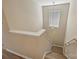 Staircase view exhibiting natural light with hardwood floors and painted walls, blending functionality with style at 1008 Newton Ave, Rock Hill, SC 29732