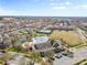 High angle shot of a home's roof, yard, fence and street at 1016 Filly Dr, Indian Trail, NC 28079