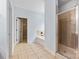 Large bathroom with glass shower, tub, and neutral tile flooring at 1016 Filly Dr, Indian Trail, NC 28079