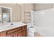 Bathroom featuring a sink, toilet, shelf, and bathtub at 1016 Filly Dr, Indian Trail, NC 28079