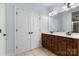 Large bathroom with a dual sink vanity, tile flooring and large closet at 1016 Filly Dr, Indian Trail, NC 28079