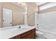 Clean bathroom featuring a vanity with a white sink, a bathtub with shower, and tile flooring at 1016 Filly Dr, Indian Trail, NC 28079