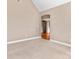 Spacious bedroom with plush carpeting and a doorway leading to the hardwood-floored foyer at 1016 Filly Dr, Indian Trail, NC 28079