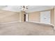 Spacious bedroom with neutral walls, plush carpet, and a ceiling fan at 1016 Filly Dr, Indian Trail, NC 28079