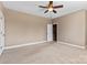 Neutral bedroom featuring a ceiling fan, neutral walls, and carpet at 1016 Filly Dr, Indian Trail, NC 28079
